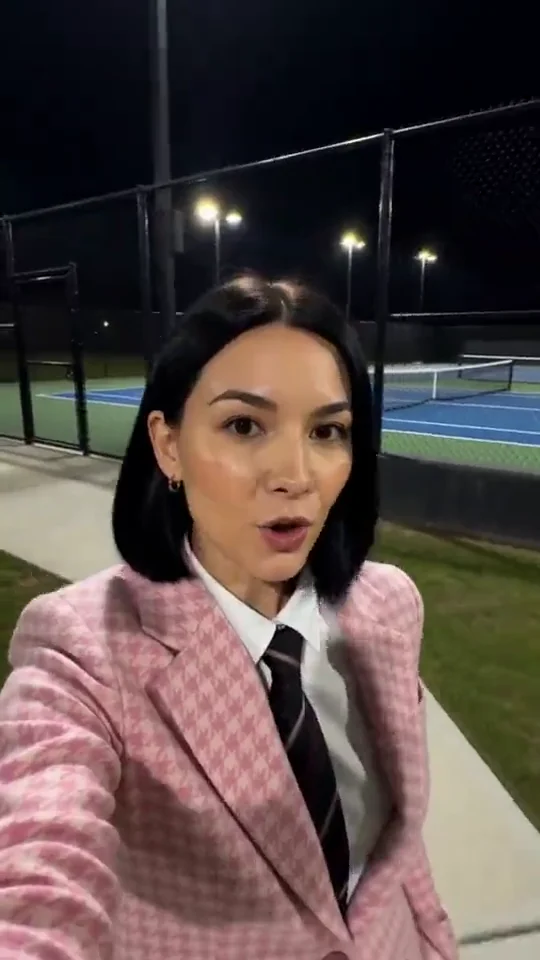Pink suit by the tennis court